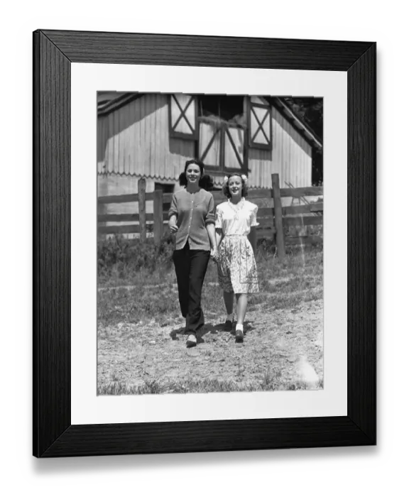 Framed Print : Mother with teenage daughter(13-14) walking on field in front of barn Framed Print : Mother with teenage daughter(13-14) walking on field in front of barn