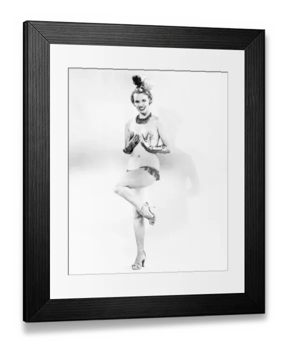 Framed Print : Woman in stage costume posing in studio (B&W) Framed Print : Woman in stage costume posing in studio (B&W)