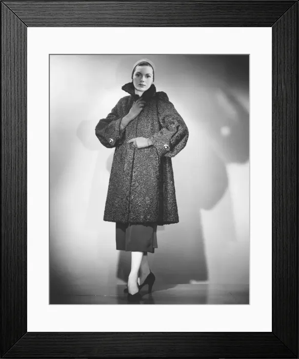 Framed Print : Woman wearing fur coat posing in studio (B&W) Framed Print : Woman wearing fur coat posing in studio (B&W)