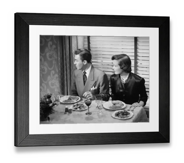 Framed Print : Couple eating dinner (B&W), elevated view Framed Print : Couple eating dinner (B&W), elevated view