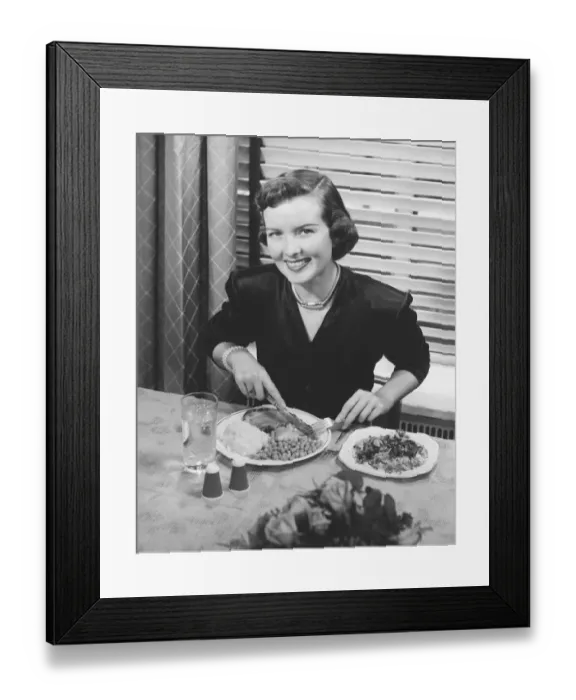 Framed Print : Woman eating dinner (B&W), elevated view Framed Print : Woman eating dinner (B&W), elevated view