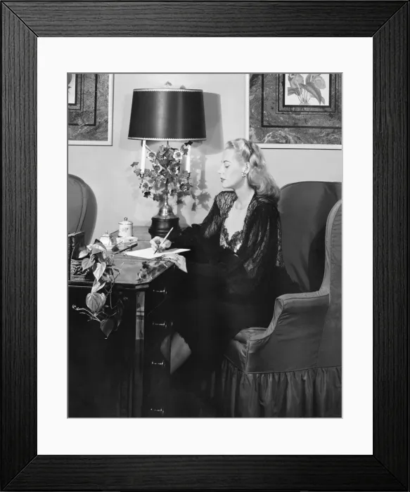 Framed Print : Elegant woman writing at desk (B&W) Framed Print : Elegant woman writing at desk (B&W)