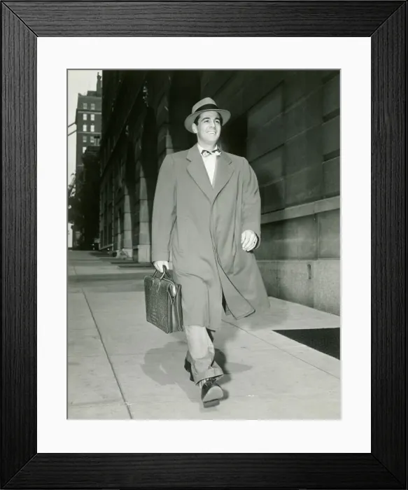 Framed Print : Man walking along sidewalk Framed Print : Man walking along sidewalk