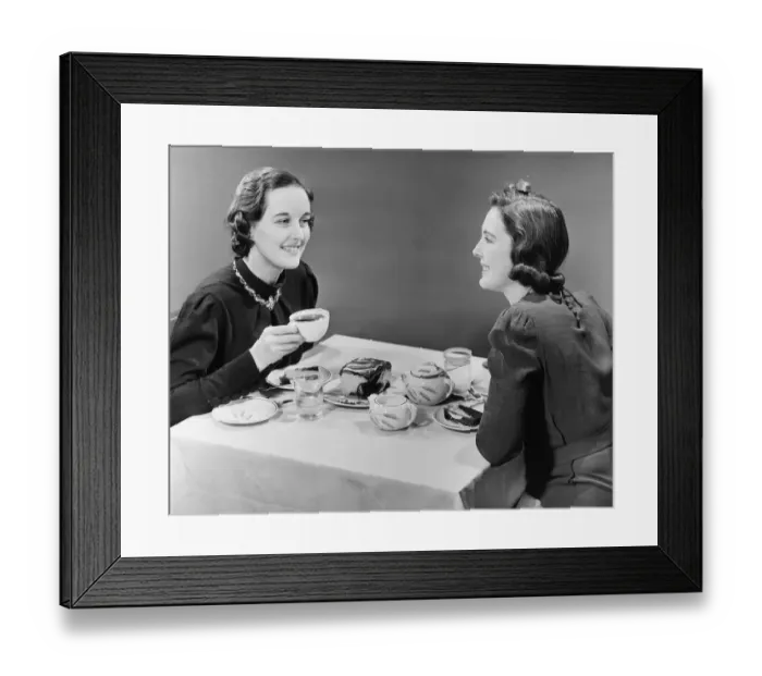 Framed Print : Two women having coffee and cake (B&W) Framed Print : Two women having coffee and cake (B&W)