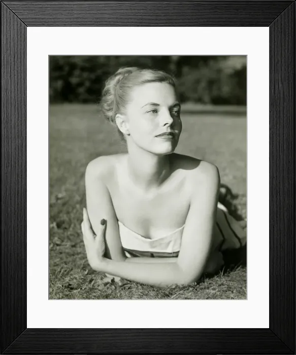 Framed Print : Young woman lying on grass Framed Print : Young woman lying on grass