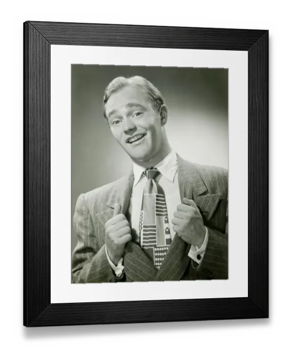 Framed Print : Man pulling sides of jacket apart to reveal tie, portrait Framed Print : Man pulling sides of jacket apart to reveal tie, portrait