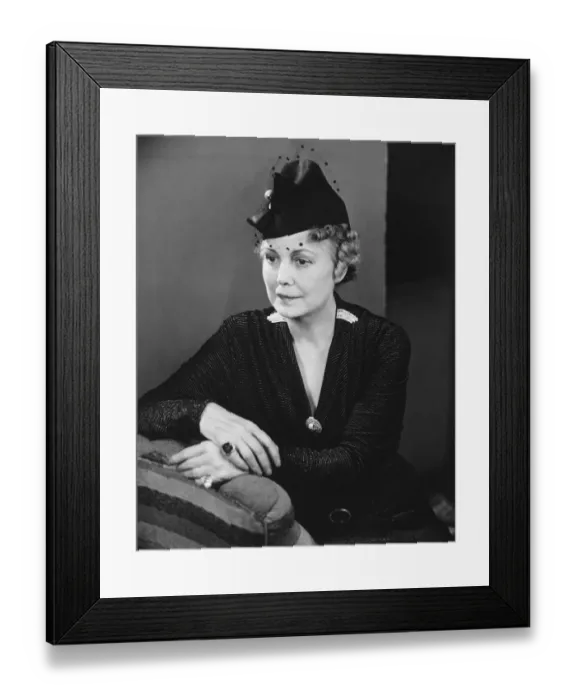 Framed Print : Mature woman in fancy hat posing in studio (B&W), portrait Framed Print : Mature woman in fancy hat posing in studio (B&W), portrait