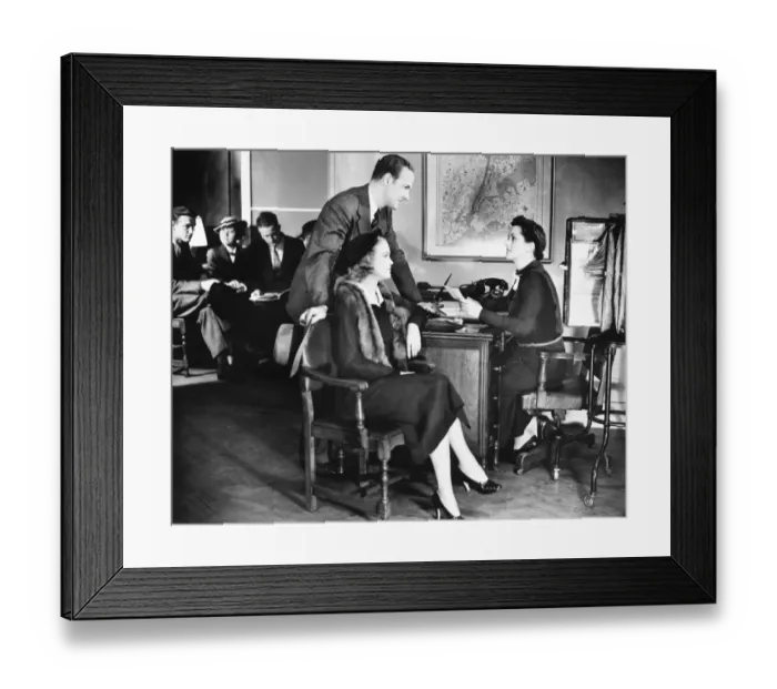 Framed Print : Couple applying for mortgage, talking to clerk (B&W) Framed Print : Couple applying for mortgage, talking to clerk (B&W)