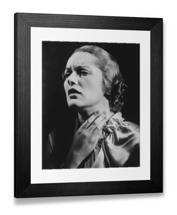 Framed Print : Frowning woman touching throat (B&W) Framed Print : Frowning woman touching throat (B&W)