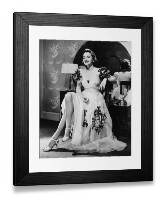 Framed Print : Woman in evening gown sitting at vanity table (B&W), portrait Framed Print : Woman in evening gown sitting at vanity table (B&W), portrait