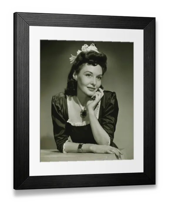 Framed Print : Young woman in evening wear in studio, (B&W), close-up Framed Print : Young woman in evening wear in studio, (B&W), close-up