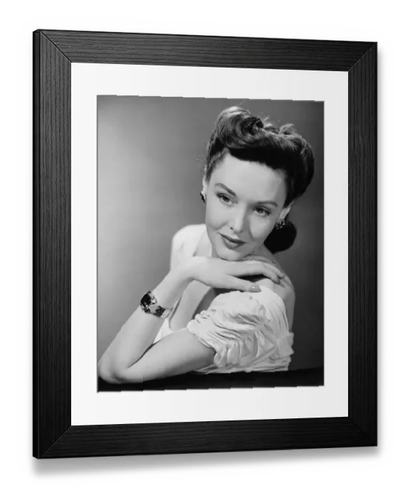 Framed Print : Young woman in evening wear in studio, (B&W), close-up Framed Print : Young woman in evening wear in studio, (B&W), close-up