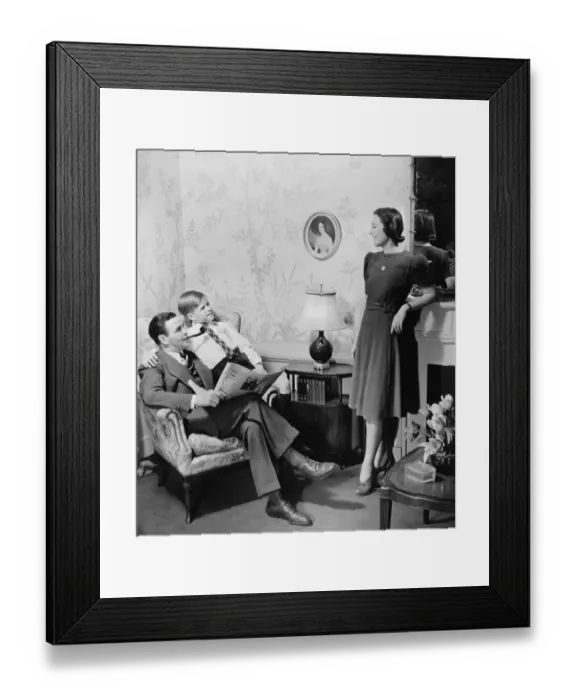 Framed Print : Parents with son (8-9) in living room (B&W) Framed Print : Parents with son (8-9) in living room (B&W)