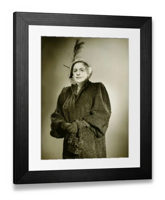 Framed Print : Elegant mature woman in hat and coat posing in studio, (B&W), (Portrait) Framed Print : Elegant mature woman in hat and coat posing in studio, (B&W), (Portrait)
