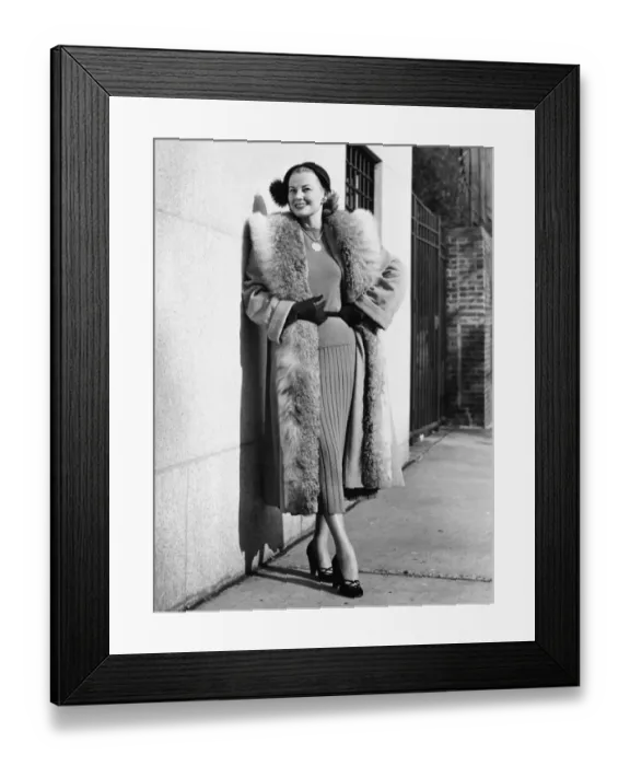 Framed Print : Woman wearing fur coat posing outdoors, (B&W), (Portrait) Framed Print : Woman wearing fur coat posing outdoors, (B&W), (Portrait)