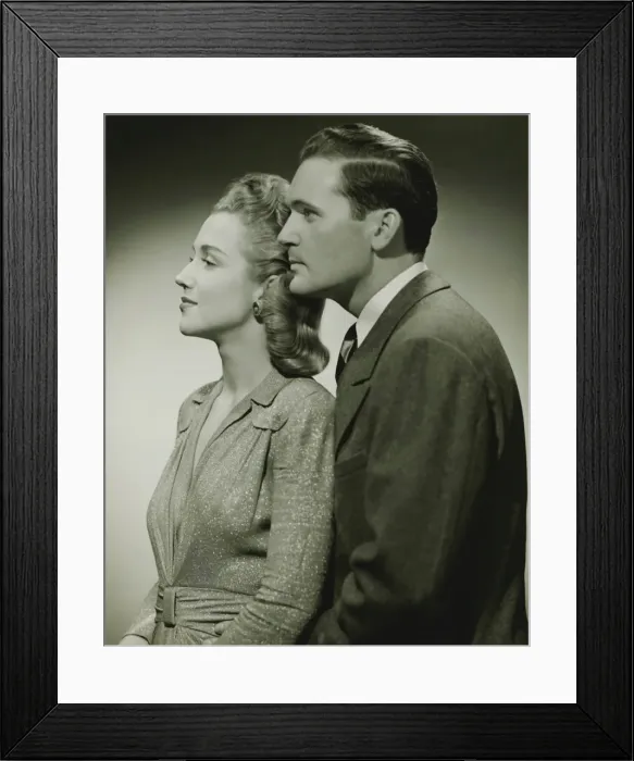 Framed Print : Young couple in studio, (B&W), close-up Framed Print : Young couple in studio, (B&W), close-up