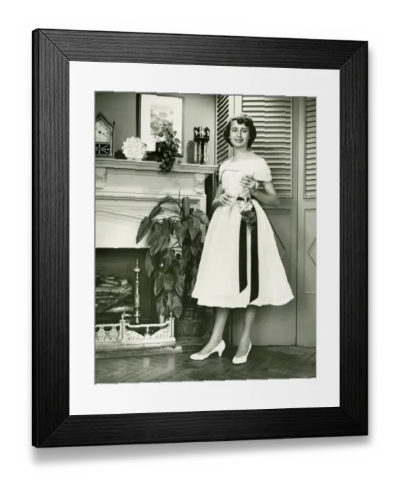 Framed Print : Woman in fashionable dress posing at fireplace, (B&W), (Portrait)