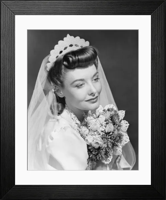 Framed Print : Bride holding bouquet, posing in studio (B&W), , portrait Framed Print : Bride holding bouquet, posing in studio (B&W), , portrait