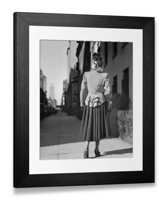 Framed Print : Elegant woman standing alone on sidewalk, Rear view, (B&W) Framed Print : Elegant woman standing alone on sidewalk, Rear view, (B&W)