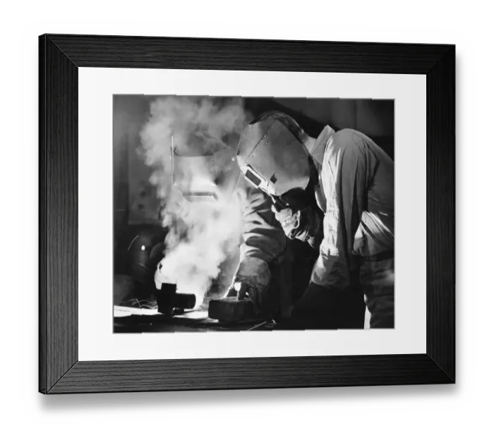 Framed Print : Two men welding, holding protective masks, (B&W) Framed Print : Two men welding, holding protective masks, (B&W)