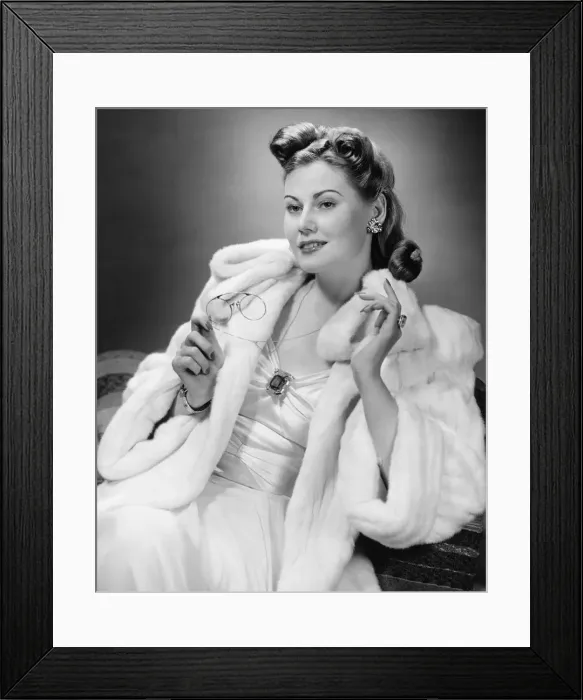 Framed Print : Woman in evening wear posing in studio (B&W), portrait Framed Print : Woman in evening wear posing in studio (B&W), portrait