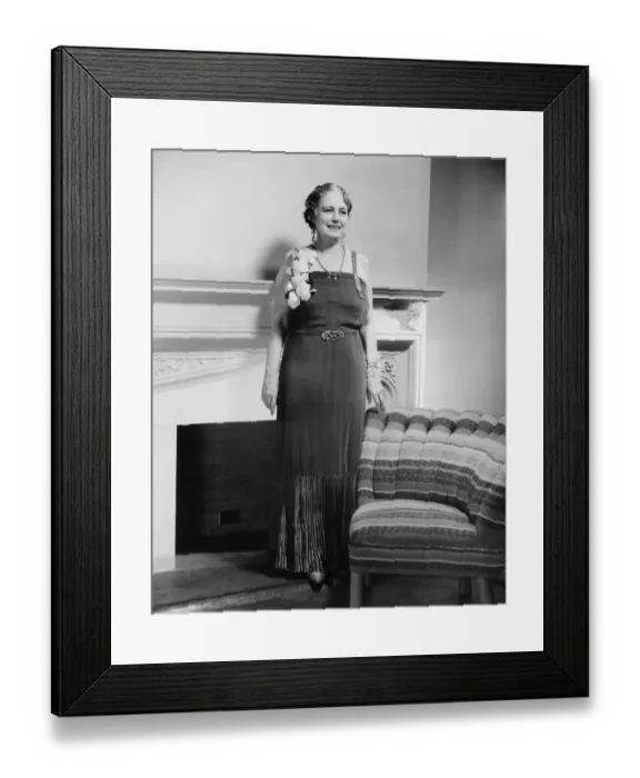Framed Print : Mature woman in evening gown posing at fireplace (B&W), portrait Framed Print : Mature woman in evening gown posing at fireplace (B&W), portrait