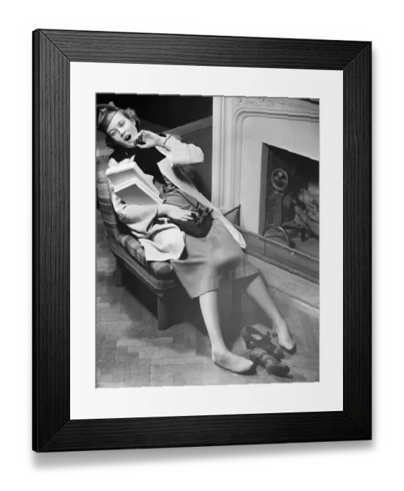 Framed Print : Woman exhausted after shopping reclining on chair, (B&W), elevated view Framed Print : Woman exhausted after shopping reclining on chair, (B&W), elevated view