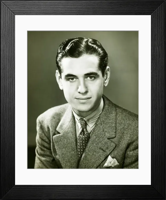 Framed Print : Young businessman posing in studio, (B&W), portrait Framed Print : Young businessman posing in studio, (B&W), portrait