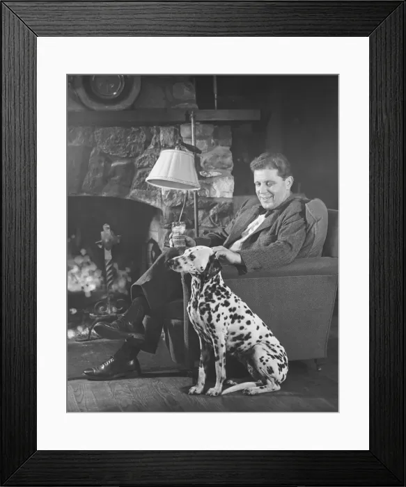 Framed Print : Man with dalmatian sitting at fireplace (B&W) Framed Print : Man with dalmatian sitting at fireplace (B&W)