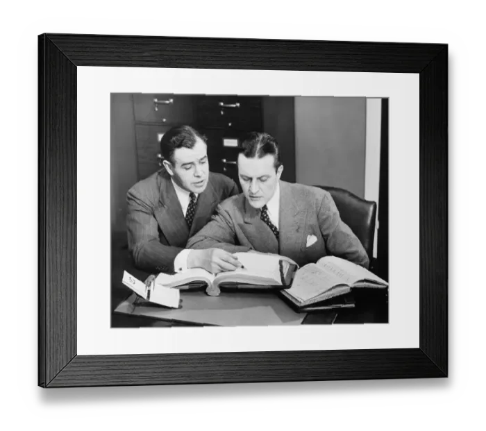 Framed Print : Two businessmen checking trading books, (B&W) Framed Print : Two businessmen checking trading books, (B&W)