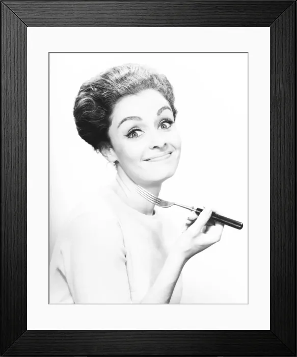 Framed Print : Smiling woman holding fork, (B&W), close-up Framed Print : Smiling woman holding fork, (B&W), close-up