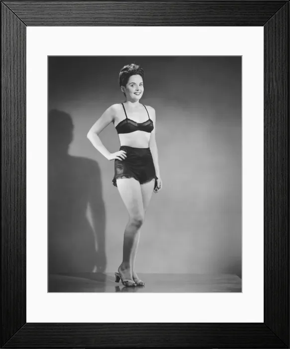 Framed Print : Woman in black underwear posing in studio, (B&W), portrait Framed Print : Woman in black underwear posing in studio, (B&W), portrait
