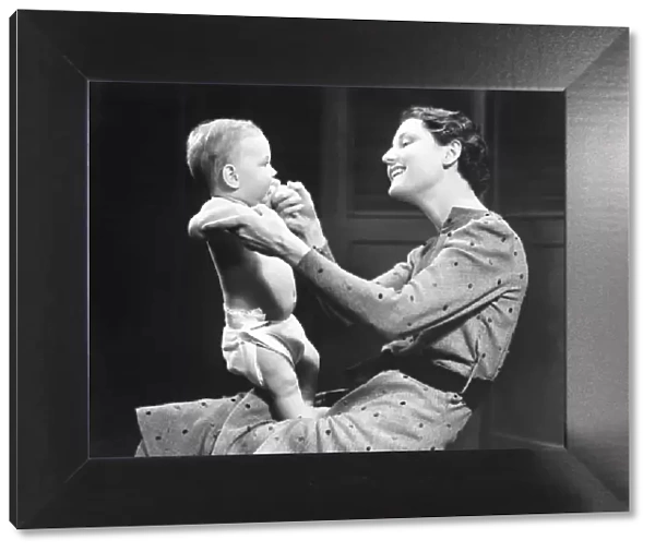 Woman playing with baby (6-9 months) (B&W)