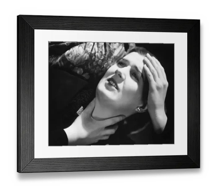 Framed Print : Woman suffering headache, laying in pillow, (B&W), close-up Framed Print : Woman suffering headache, laying in pillow, (B&W), close-up