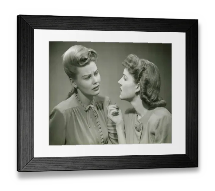 Framed Print : Two young women having serious discussion, (B&W) Framed Print : Two young women having serious discussion, (B&W)