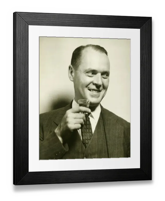 Framed Print : Man holding glass with spirit, (B&W), close-up Framed Print : Man holding glass with spirit, (B&W), close-up