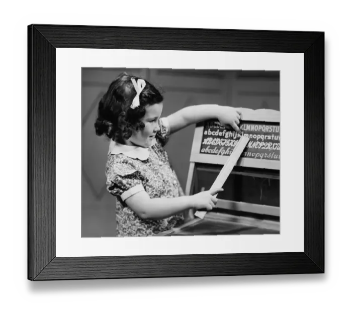 Framed Print : Girl (4-5) learning alphabet (B&W) Framed Print : Girl (4-5) learning alphabet (B&W)
