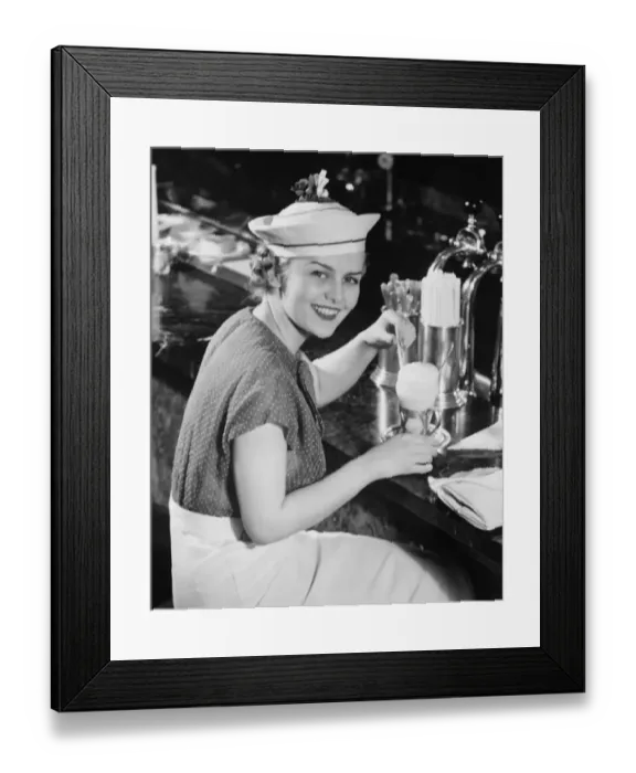 Framed Print : Young woman in fancy hat drinking ice cream soda (B&W), portrait