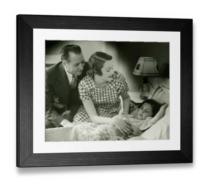Framed Print : Parents looking at sleeping daughter (6-7), (B&W) Framed Print : Parents looking at sleeping daughter (6-7), (B&W)