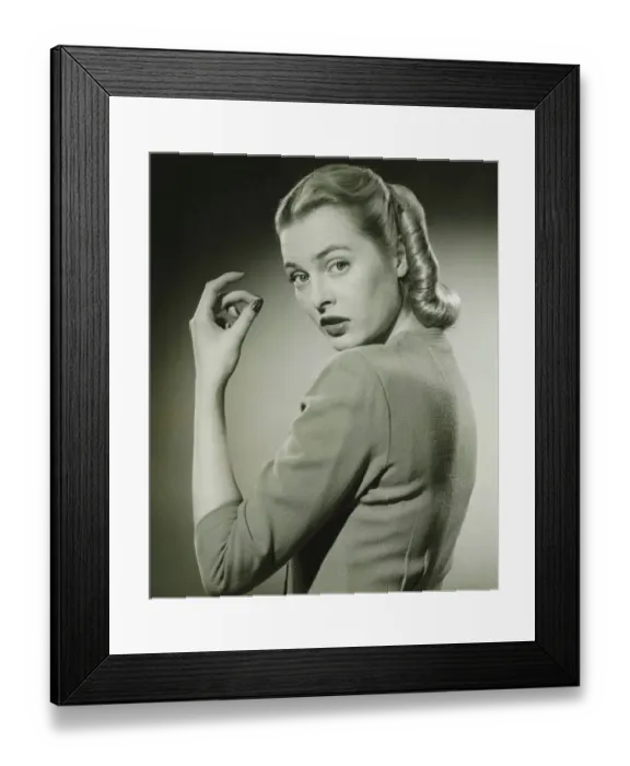 Framed Print : Young woman looking over shoulder, (B&W), portrait