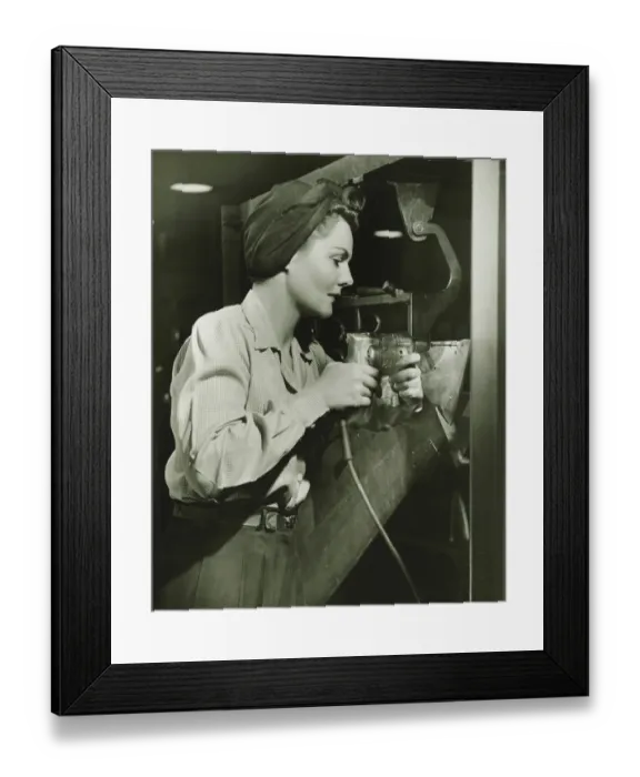 Framed Print : Woman working with electric drill in factory, (B&W) Framed Print : Woman working with electric drill in factory, (B&W)