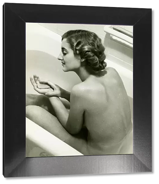 Woman taking bath, (B&W)