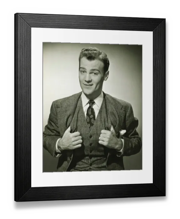 Framed Print : Businessman holding thumbs in waistcoat, smiling, (B&W), portrait Framed Print : Businessman holding thumbs in waistcoat, smiling, (B&W), portrait