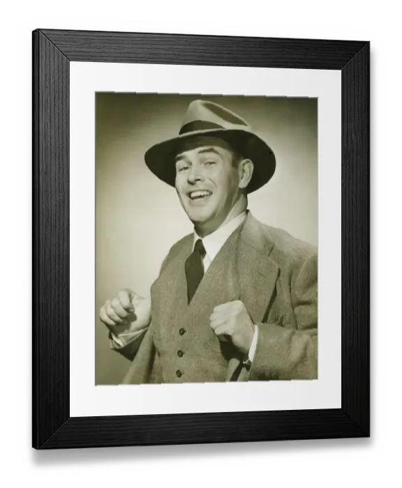 Framed Print : Businessman holding thumbs in waistcoat, smiling, (B&W), portrait Framed Print : Businessman holding thumbs in waistcoat, smiling, (B&W), portrait