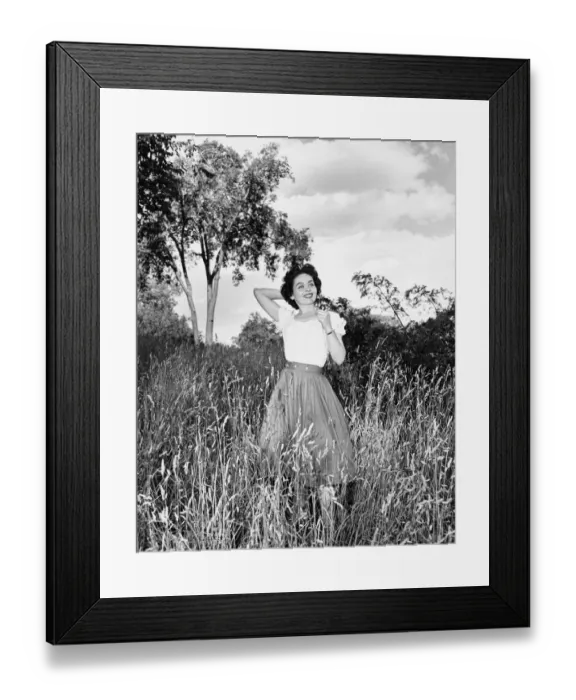 Framed Print : Woman posing on meadow, (B&W), portrait Framed Print : Woman posing on meadow, (B&W), portrait