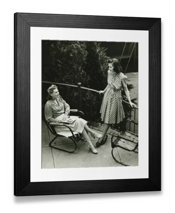 Framed Print : Two women talking on balcony, (B&W), elevated view Framed Print : Two women talking on balcony, (B&W), elevated view