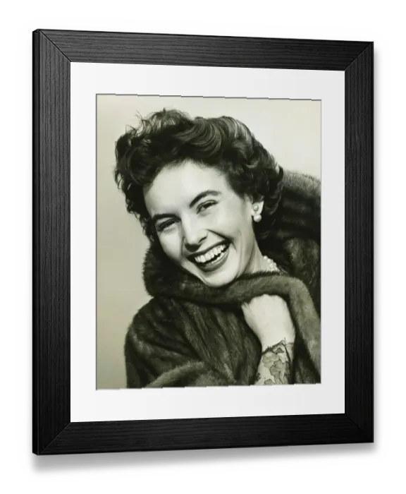 Framed Print : Woman smiling in studio, (B&W), portrait Framed Print : Woman smiling in studio, (B&W), portrait