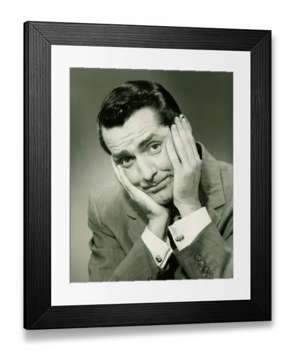 Framed Print : Businessman in studio holding head in hands, (B&W), portrait Framed Print : Businessman in studio holding head in hands, (B&W), portrait