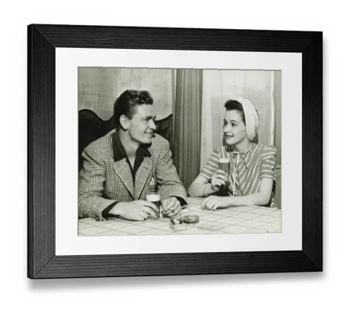 Framed Print : Couple drinking beer at bar table, (B&W) Framed Print : Couple drinking beer at bar table, (B&W)