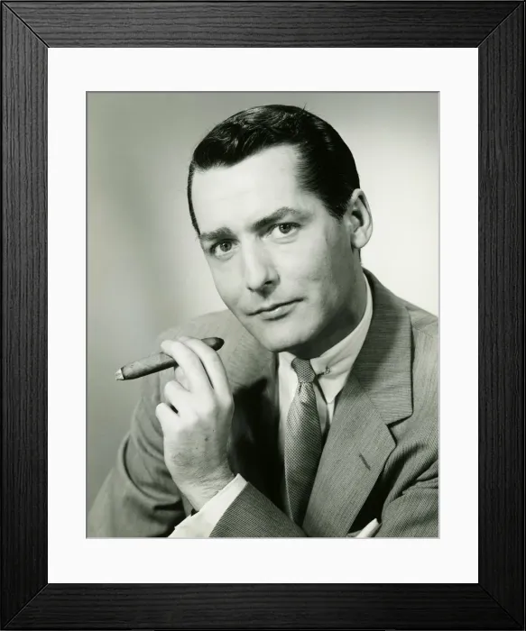 Framed Print : Businessman in studio holding cigar, (B&W), portrait Framed Print : Businessman in studio holding cigar, (B&W), portrait